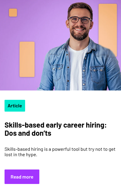 Person in blue tshirt with blue overshirt in front of purple background