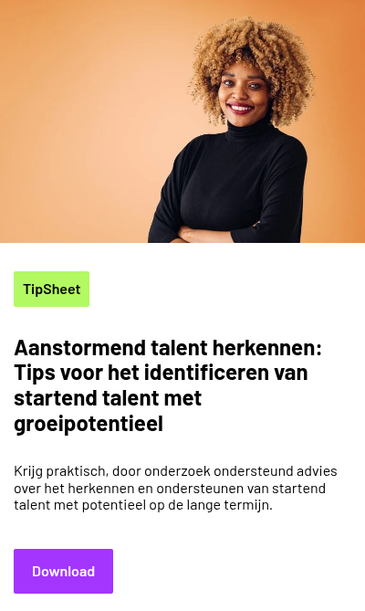 A person with curly hair wearing a plain turtleneck