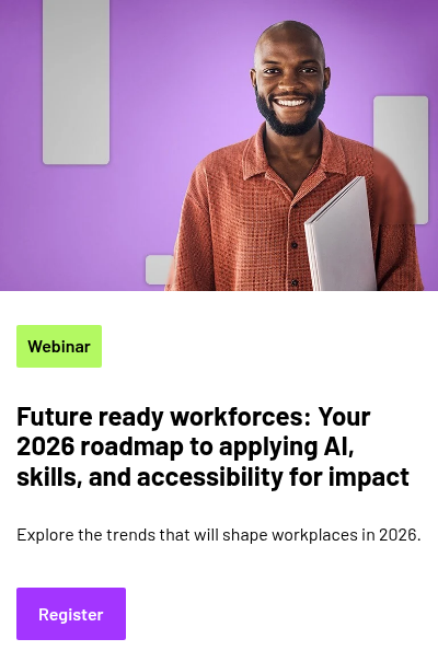 A person holding a closed laptop or notebook, wearing a shirt, with rectangular shapes in the background.